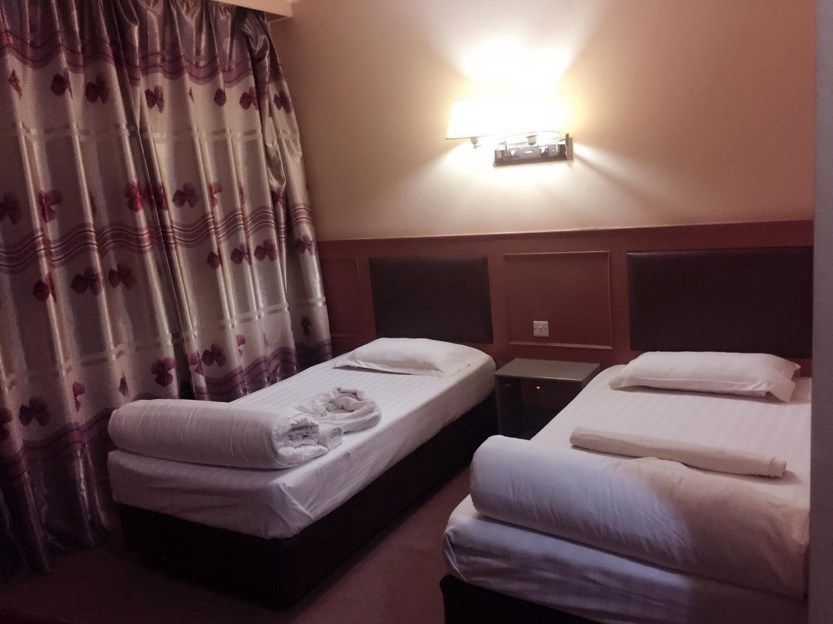 New Yuetan Hotel ダル・エス・サラーム エクステリア 写真